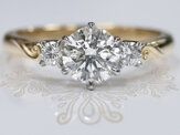 18ct gold platinum diamond three stone engagement ring with koru motif detail