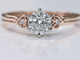 18ct rose gold unique koru heart diamond detail solitaire engagement ring