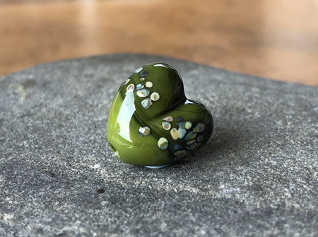 1x handmade glass bead - heart - jitterbug on cave green