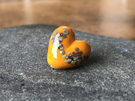 1x handmade glass bead - heart - jitterbug on light orange