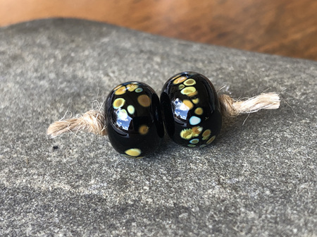 2x handmade glass beads - frit - jitterbug on black