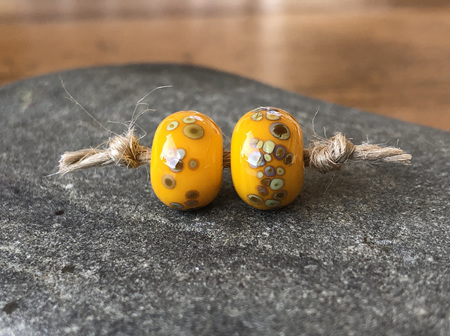 2x handmade glass beads - frit - jitterbug on yellow