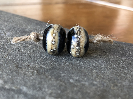 2x Handmade glass beads - pure silver trails - Sandstone on black
