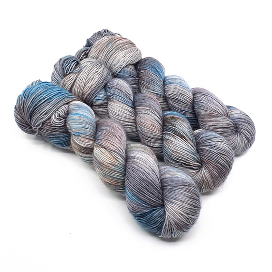 3 twisted skeins of 4ply merino in grey, turquoise blue and brown hues