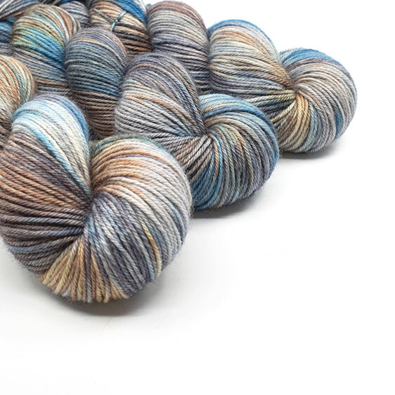 3 twisted skeins of DK Bluefaced Leicester in grey, turquoise blue and brown