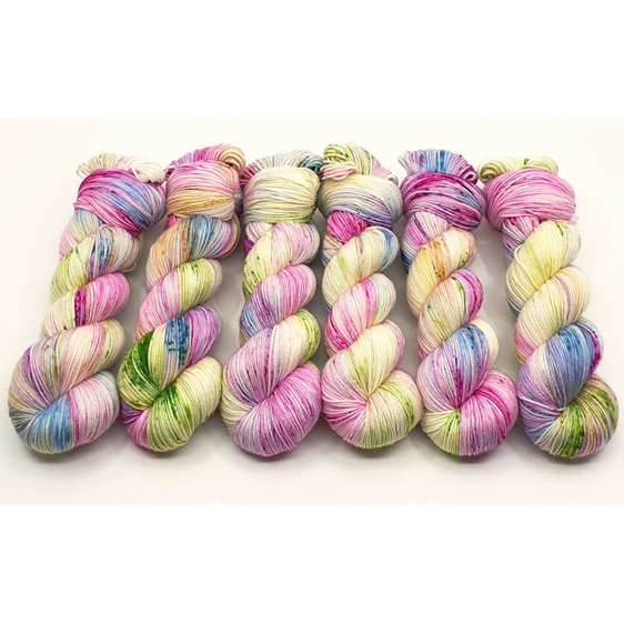 6 twisted skeins of variegated yarn in pink, blue, green, yellow, lilac