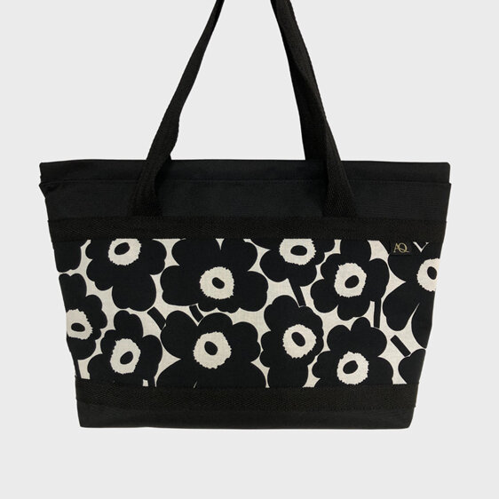 A bag with a zip to keep your belongings safe featuring Marimekko fabric