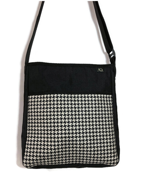 A black and beige handbag in a useful size for everyday work or play.