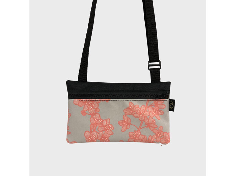 A Cherry Blossom fabric on a beautifully made phone bag perfect for walking