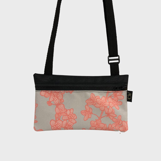 A Cherry Blossom fabric on a beautifully made phone bag perfect for walking