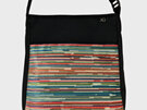 A fabric handbag with fun stripes on the front pocket. NZ made.