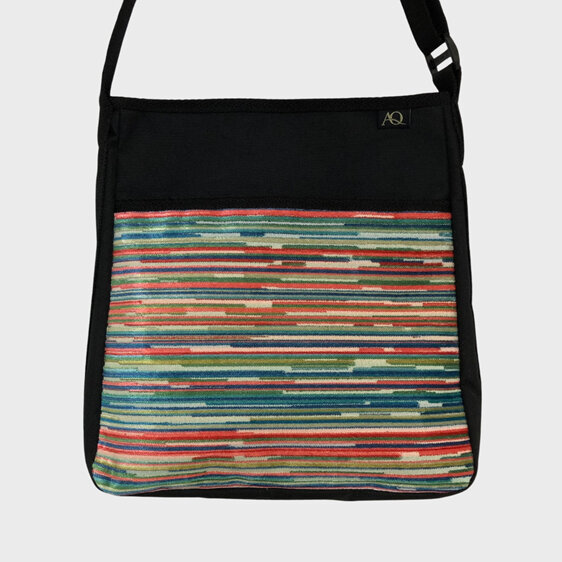 A fabric handbag with fun stripes on the front pocket. NZ made.