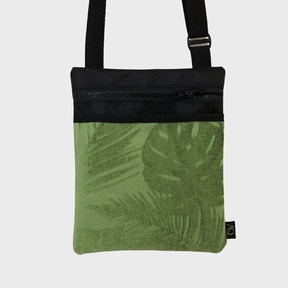 A green textured fabric with Monstera and fern leaves.  Unique and stylish.