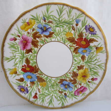 A hand painted floral plate
