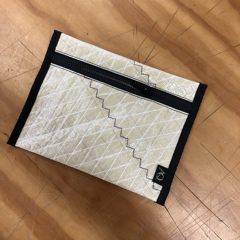 A Kevlar sail upcycled into a zippered pouch.