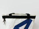 A number 4 is on the back of the recycled sailcloth shopping bag