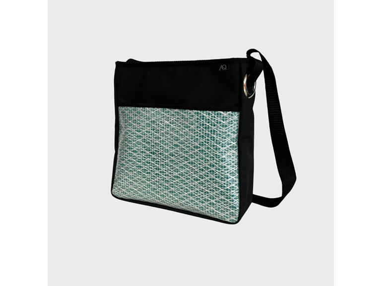 A sailcloth crossbody bag suitable for work and play.