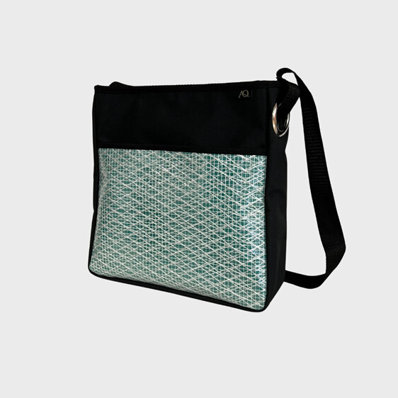 A sailcloth crossbody bag suitable for work and play.