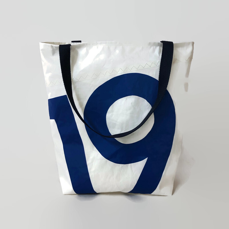 A sailcloth tote bag with number 19 on the front.