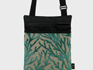 A seaweed fabric on the front pocket of a small crossbody bag