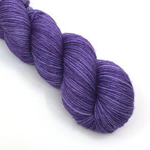 a skein of DK weight 100% merino is a semi-solid lilac colour