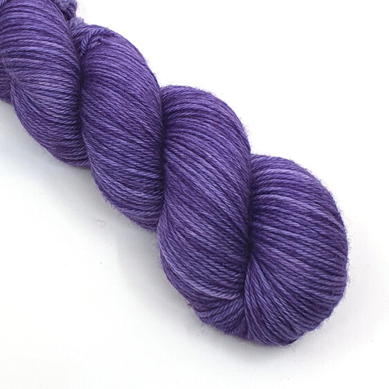 a skein of DK weight 100% merino is a semi-solid lilac colour