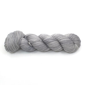 a skein of DK weight 100% merino wool in a semi-solid platinum grey