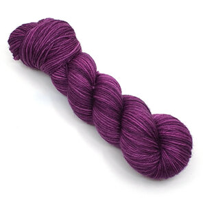 A skein of DK weight 100% merino wool in a tonal purple