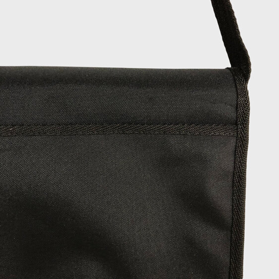 A slip pocket on the outside of a large work bag perfect for a laptop
