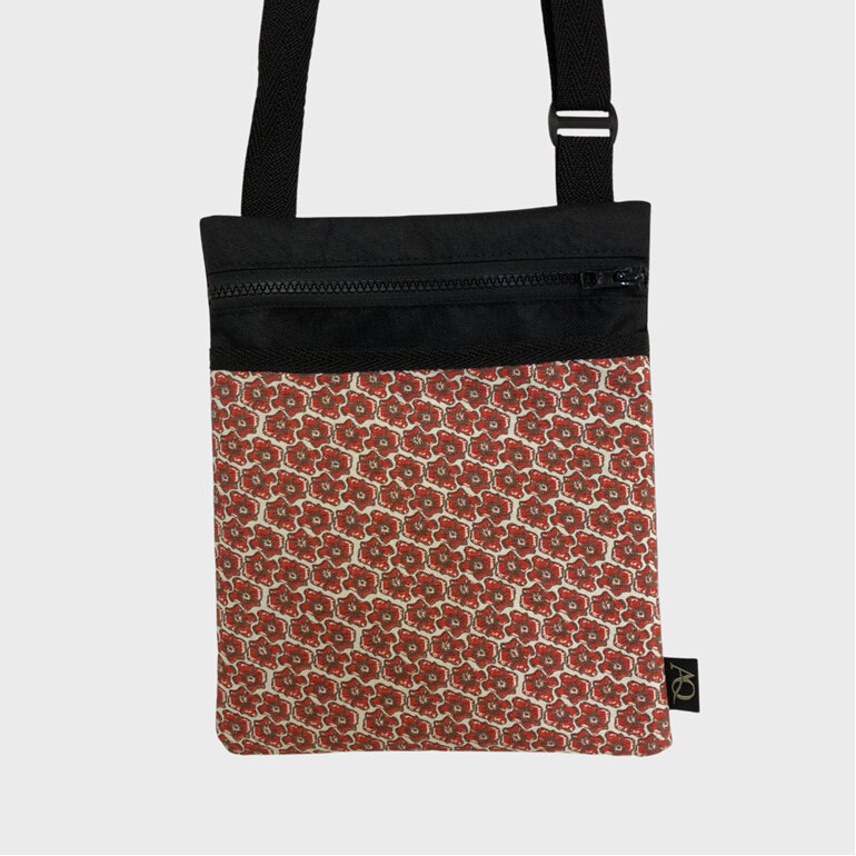 A small, slim New Zealand made bag in a pretty flower fabric.