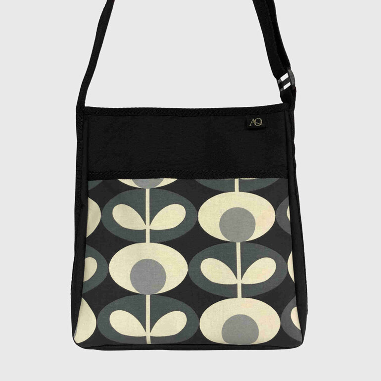A stylish Orla Kiely fabric handbag with multiple pockets to keep you organised.