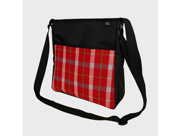 A tarten crossbody bag perfect for your work or the weekend.