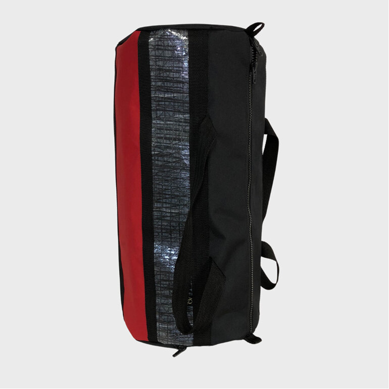 A travel gear bag with a difference, made from sailcloth in black and red