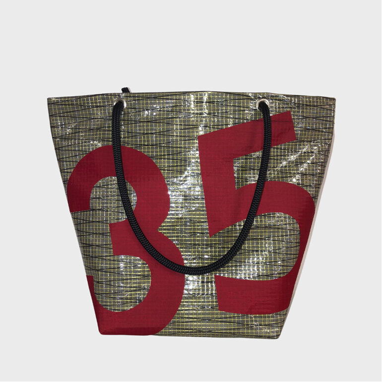 A unique upcycled sail tote bag with the numbers 35 on the front.