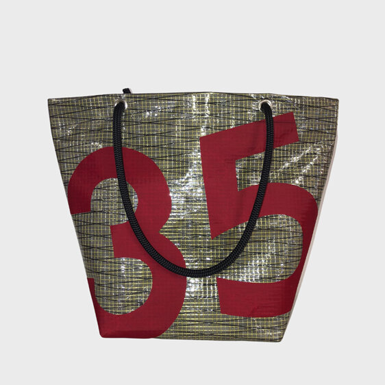 A unique upcycled sail tote bag with the numbers 35 on the front.