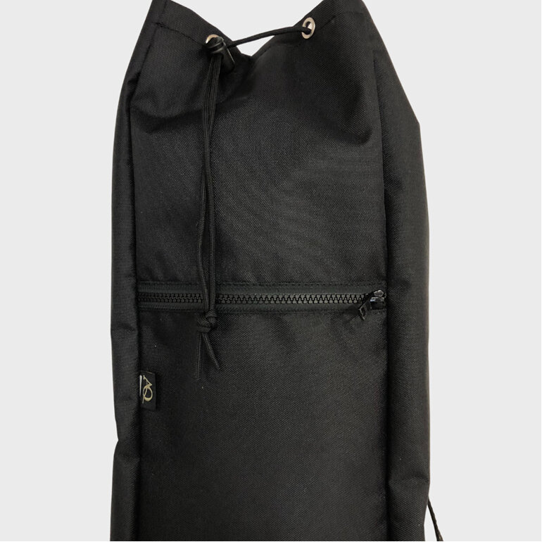 A yoga bag with pockets including a drink bottle pocket and a zip pocket