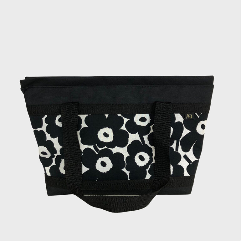 A zippered handbag large enough for a laptop made in Marimekko fabric