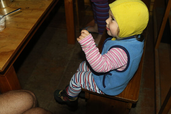 baby toddler in a doc hut in new zealand hike