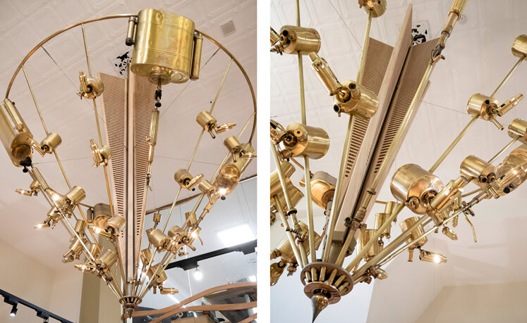Beautiful gold chandelier built from antique tools and LED lights