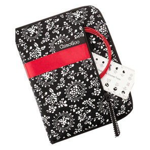 black and white case with red band, with side zip with red cable and white gauge
