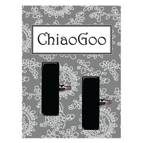 Black rectangular shaped resin with metal connector on grey floral background