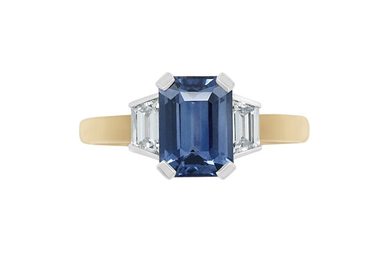 Blue octagonal sapphire trapezoid diamond side three stone engagement dress ring