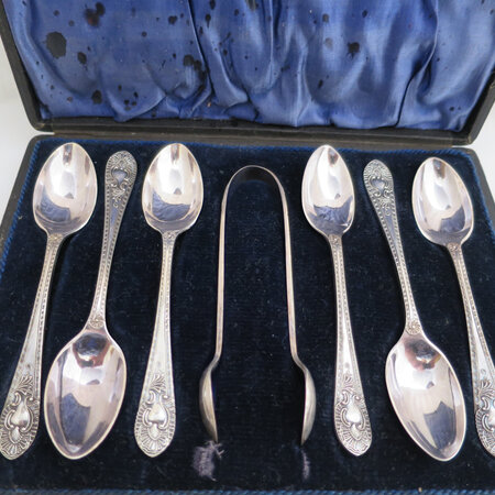Boxed set of spoons and sugar tongs