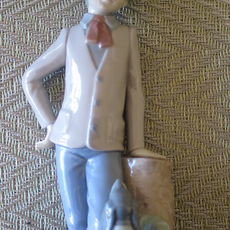 Boy with dog figurine