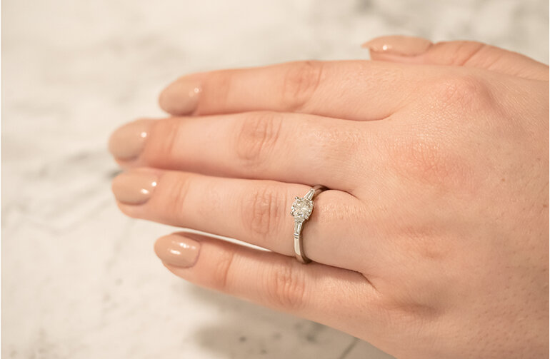 Brilliant Cut Diamond Ring with Baguettes on hand