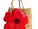 Brilliant red ceramic poppy in kete bag