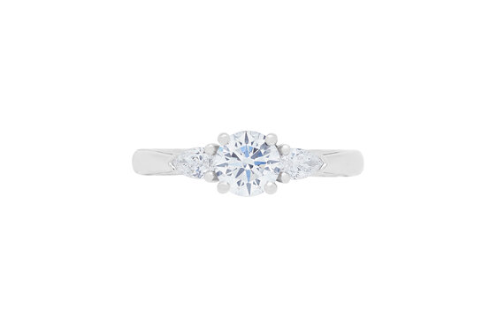 Brilliant solitaire with pear cut diamond shoulders, platinum, engagement ring