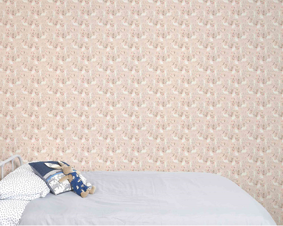 Bunny wallpaper on pink background with bed and velveteen rabbit