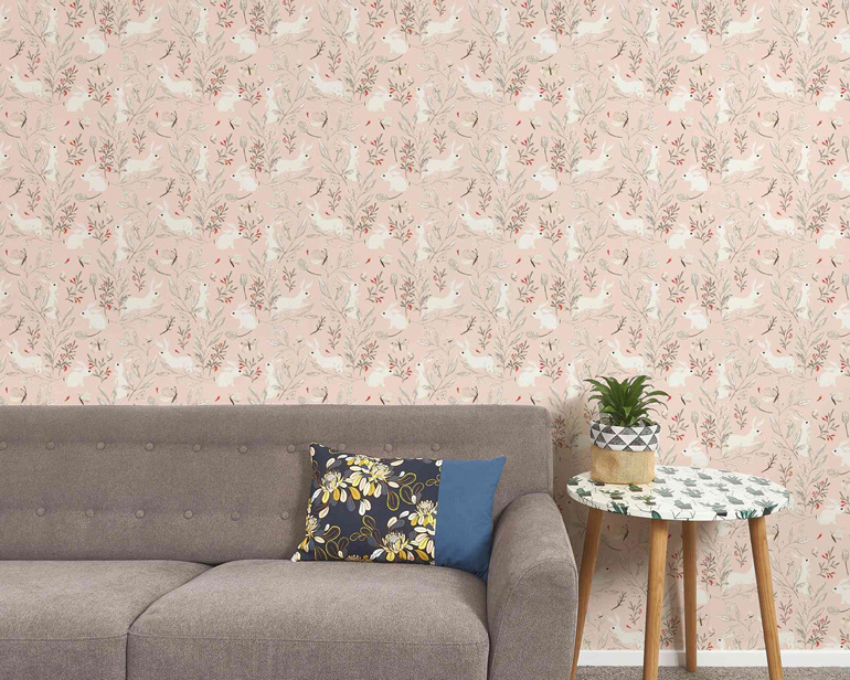 Bunny wallpaper on pink background with couch, table and plant