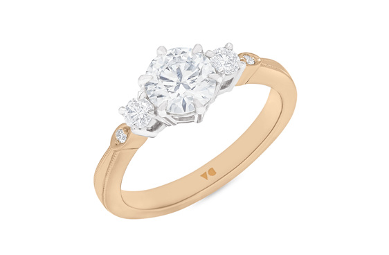 Celtic inspired diamond three stone ring 18ct rose gold platinum milgrain edge